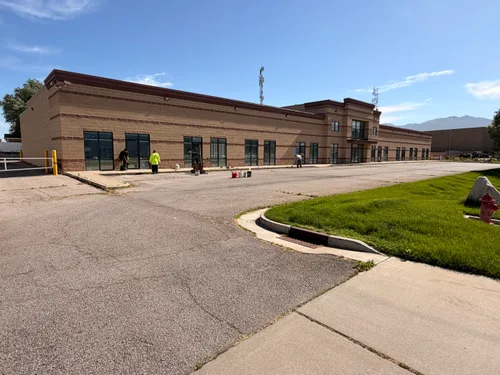 Commercial parking lot damage before repair