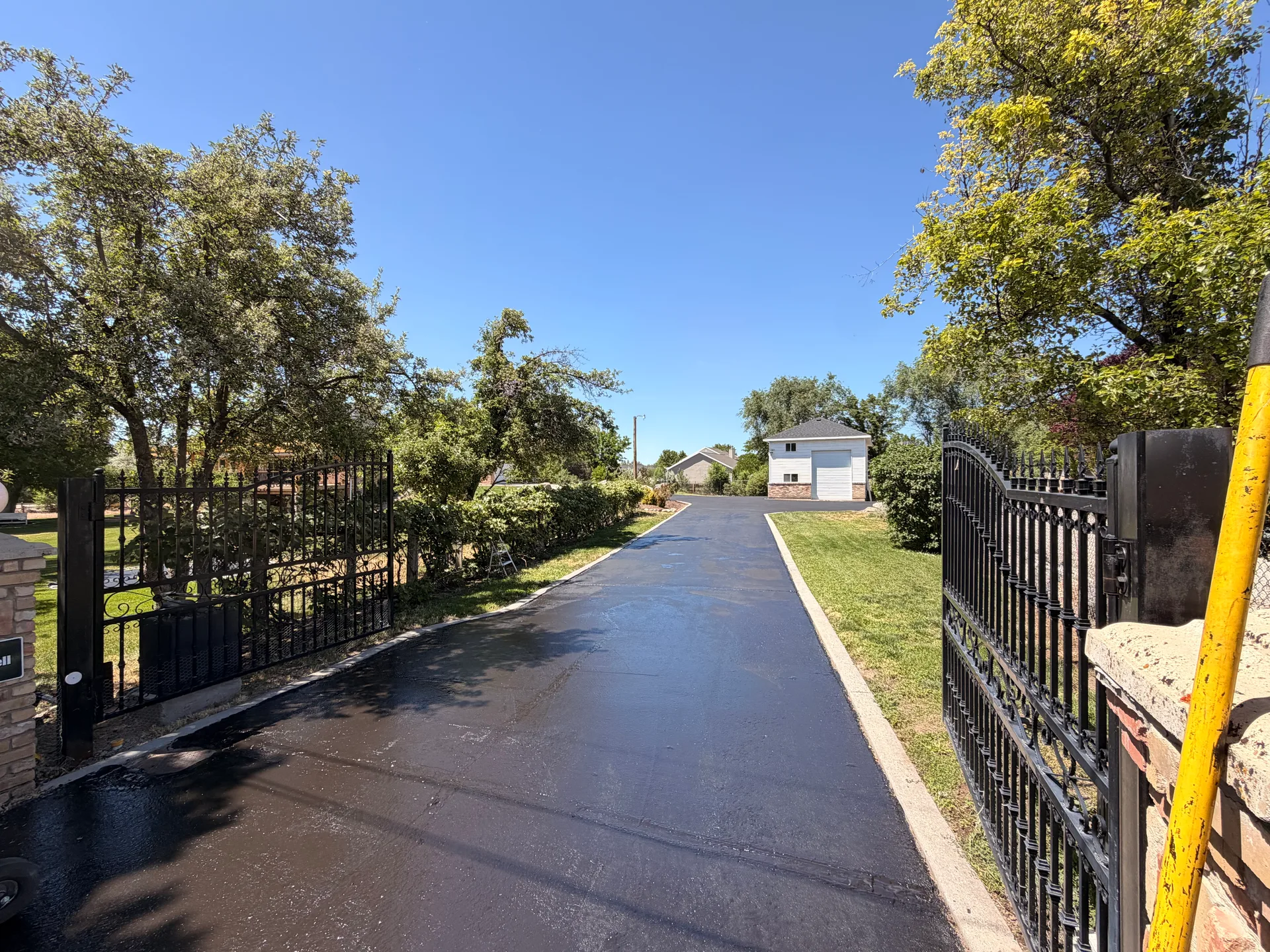 Freshly sealcoated gated driveway